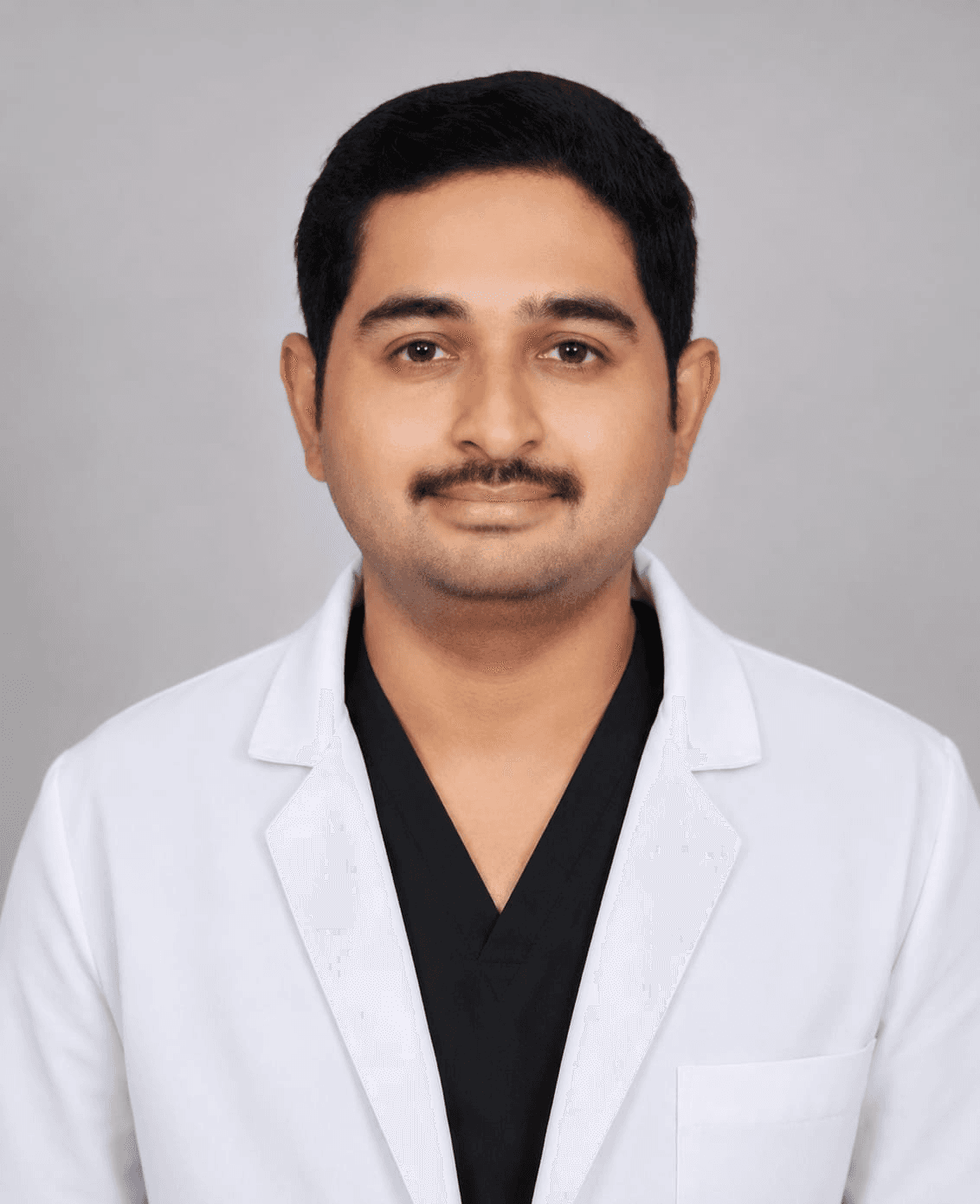 Dr. CH. Rajashekar Rao, professional headshot in a white coat